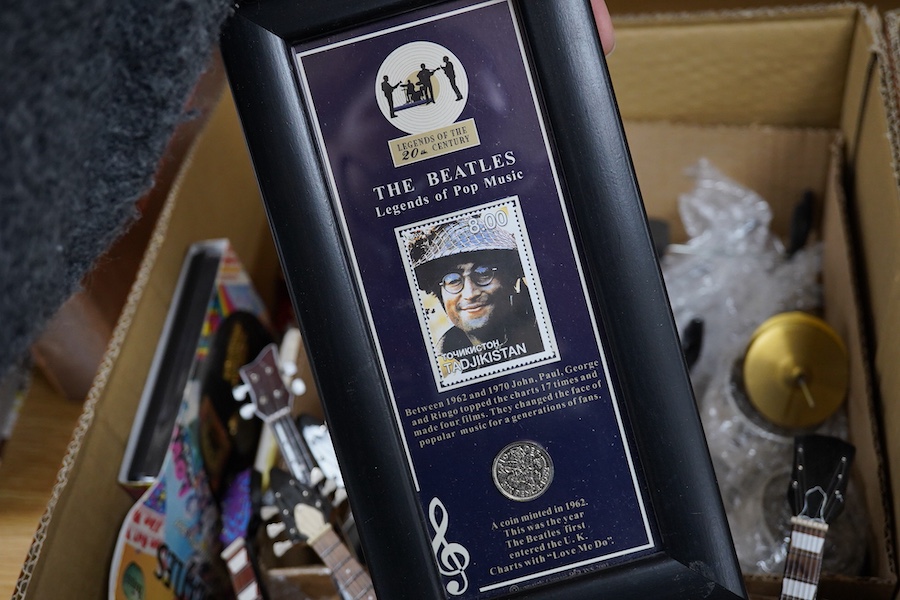 A collection of Beatles memorabilia including; models of a Beatles drum kit and eight miniature guitars and stands, each approx 25cm long, together with three boxed Corgi Beatles related models, including the Yellow Subm